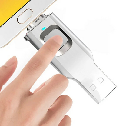 Finger pressing fingerprint sensor on SecureKey USB drive